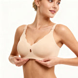 Woman wearing a beige bra on a white background