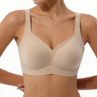 Beige bra worn by a model on a white background
