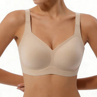 Beige bra worn by a model on a white background
