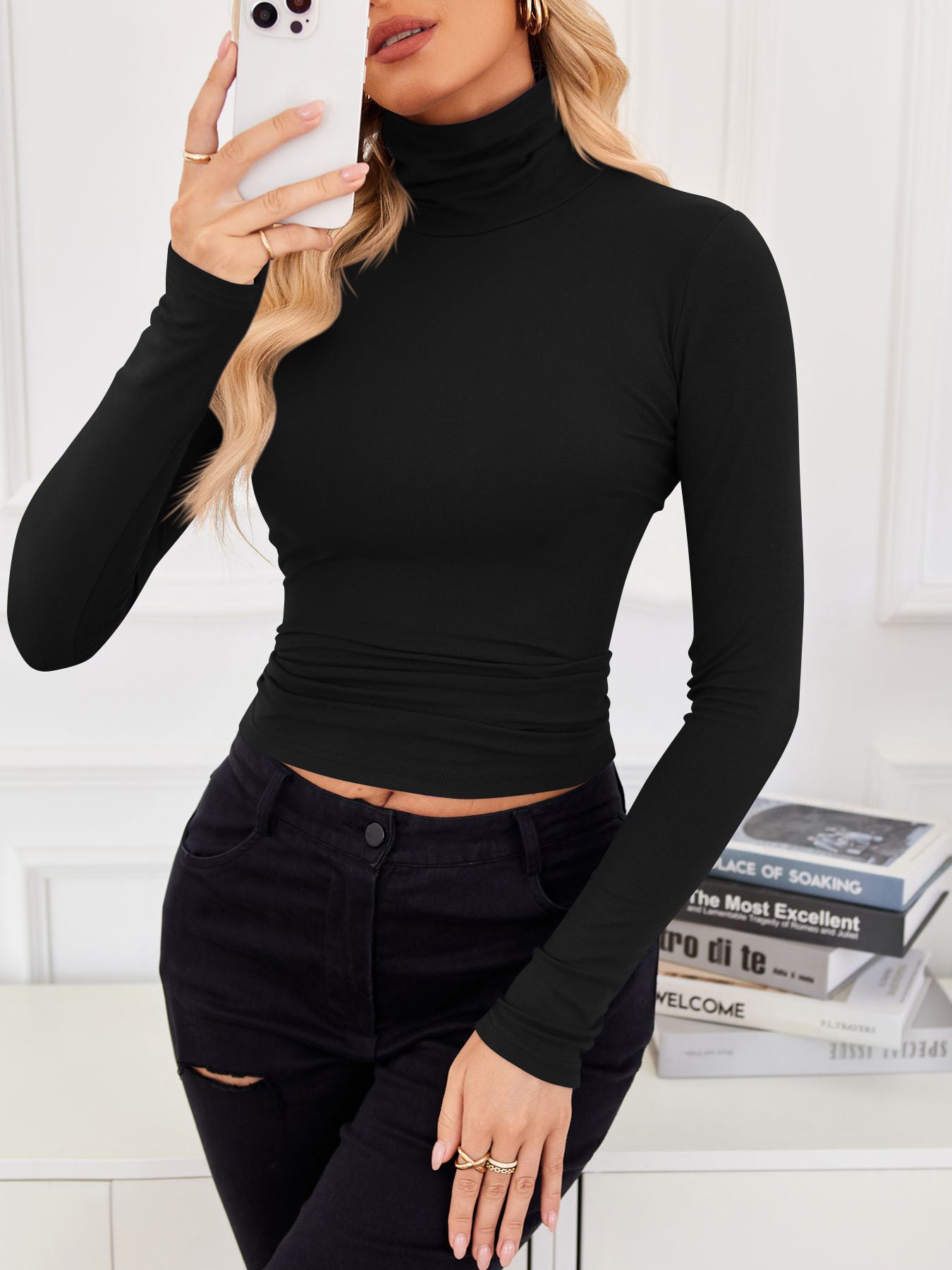 VRCÔMFY black turtleneck cropped top with contour-defining fit, styled with distressed black jeans against an intellectual studious backdrop | Urban minimalist edge meets literary aesthetic in versatile wardrobe essentials