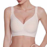 Beige bra worn by a model on a white background