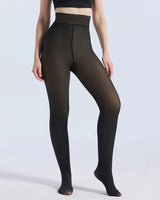 A model wearing high-waisted sheer black tights against a light gray studio background.