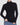 A woman wearing a fitted black long-sleeve turtleneck top with blue jeans, shown from the neck down against a light gray studio background.