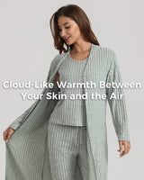 A woman modeling a ribbed knit loungewear set in a pale sage green color, featuring a long open-front cardigan and matching pants, with a text overlay on the front.