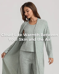 A woman modeling a ribbed knit loungewear set in a pale sage green color, featuring a long open-front cardigan and matching pants, with a text overlay on the front.
