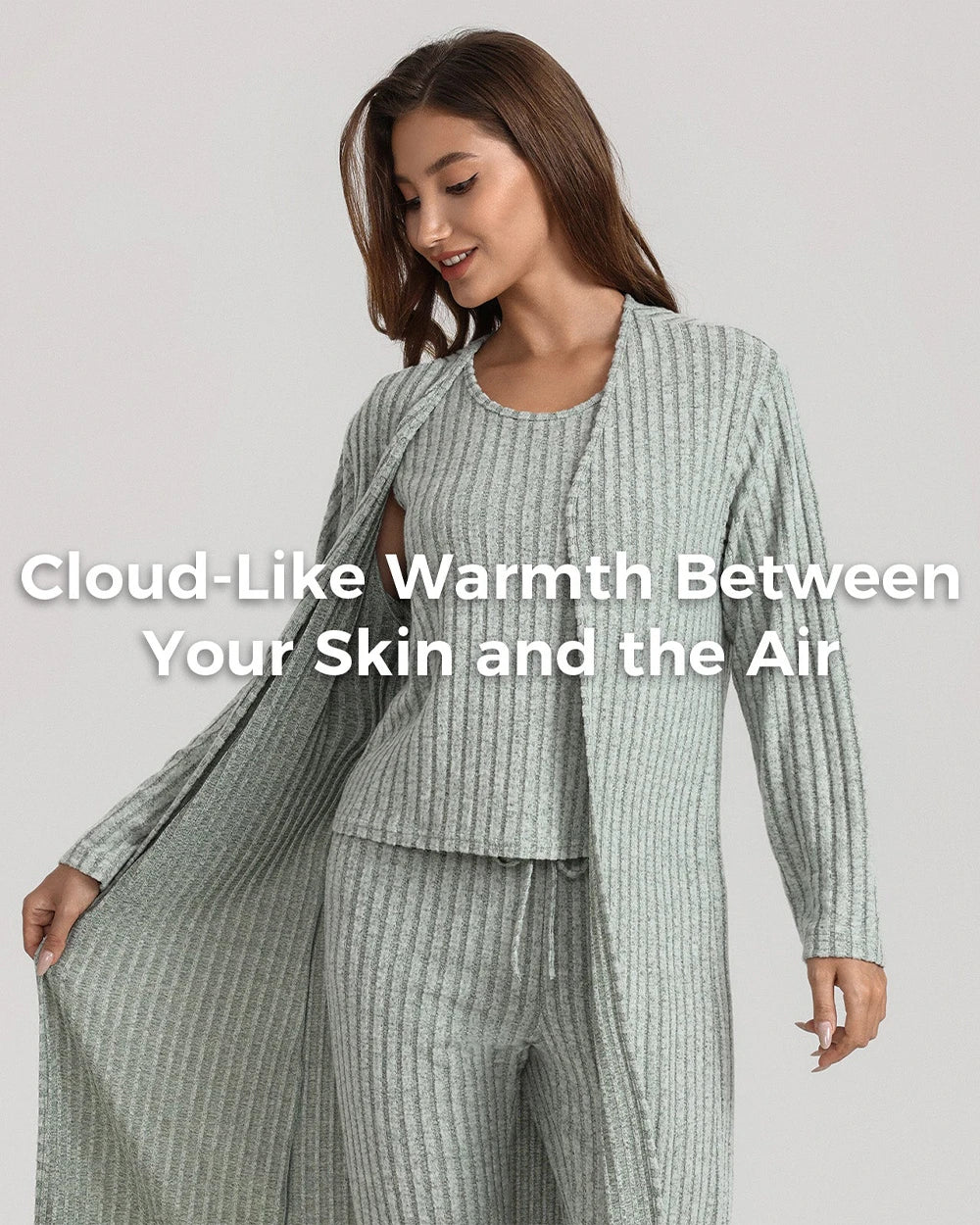 A woman modeling a ribbed knit loungewear set in a pale sage green color, featuring a long open-front cardigan and matching pants, with a text overlay on the front.