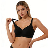 Woman wearing a black bralette against a neutral background