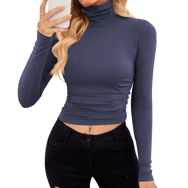 VRCÔMFY navy blue turtleneck cropped top with sculpted silhouette, paired with black skinny jeans | Modern minimalist style and refined urban elegance for fashion-forward wardrobe essentials