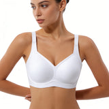 Woman wearing a white bra on a plain background
