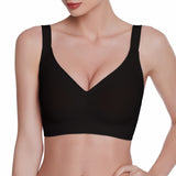 Black bra worn by a model on a white background