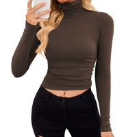 VRCÔMFY espresso brown turtleneck cropped top paired with black skinny jeans | Sculpted silhouette and polished urban style for modern minimalist fashion