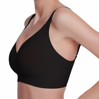 Black sports bra worn by a person on a white background