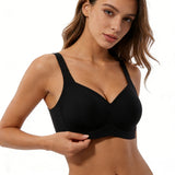 Woman wearing a black sports bra on a white background