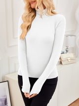 VRCÔMFY pearl white turtleneck top with sculpted silhouette, styled with onyx black trousers and sand beige bag with gilded lock-clasp | Architectural minimalism and metropolitan elegance in a curated lifestyle ensemble