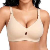 Beige bra worn by a model on a white background