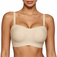 Beige bra on a model against a white background

