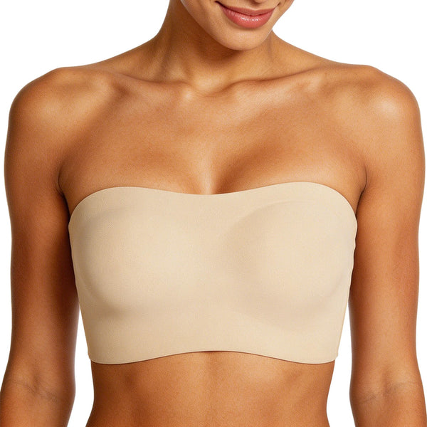 Beige strapless top worn by a model on a white background
