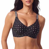 A woman wearing a black bra with white polka dots and gray adjustable straps printed with the brand name 'MOON'.