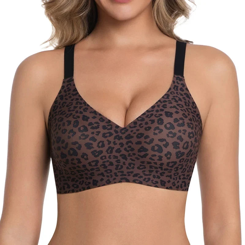 A VRCOMFY brown leopard print wireless bralette with black straps, worn by a female model