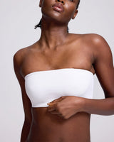 VRCOMFY Black strapless top worn by a model on a gray background