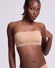  VRCOMFY Beige strapless bra worn by a model on a gray background