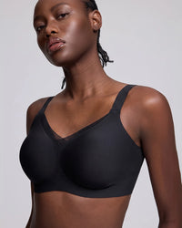VRCÔMFY black uplift wireless bra with sheer mesh accents and adjustable straps | Engineered with targeted support panels for enhanced cleavage and sculpted shape