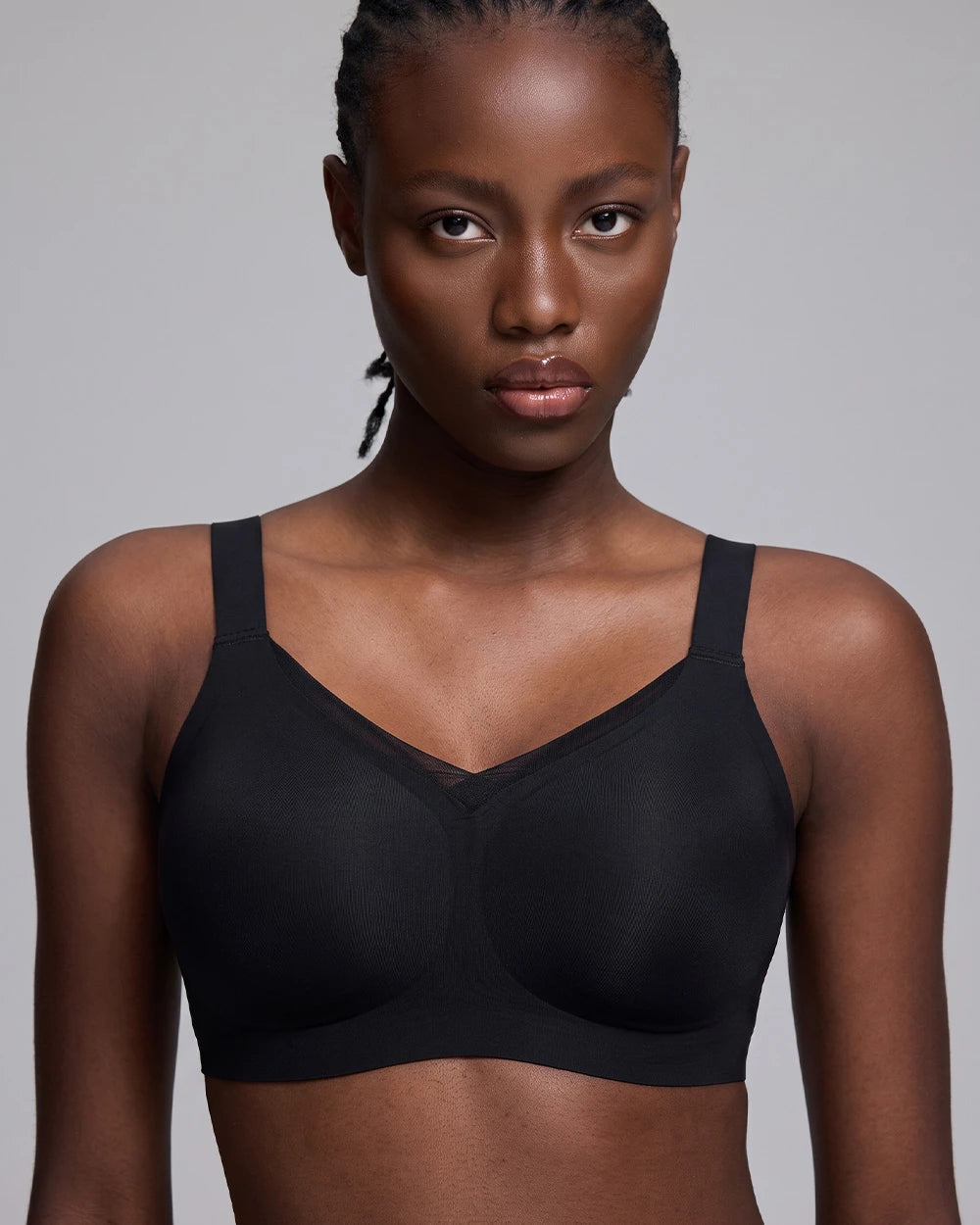 VRCÔMFY black wireless bra with sheer mesh panel detailing and adjustable straps | Modern minimalist design offering sleek contour fit and customizable support