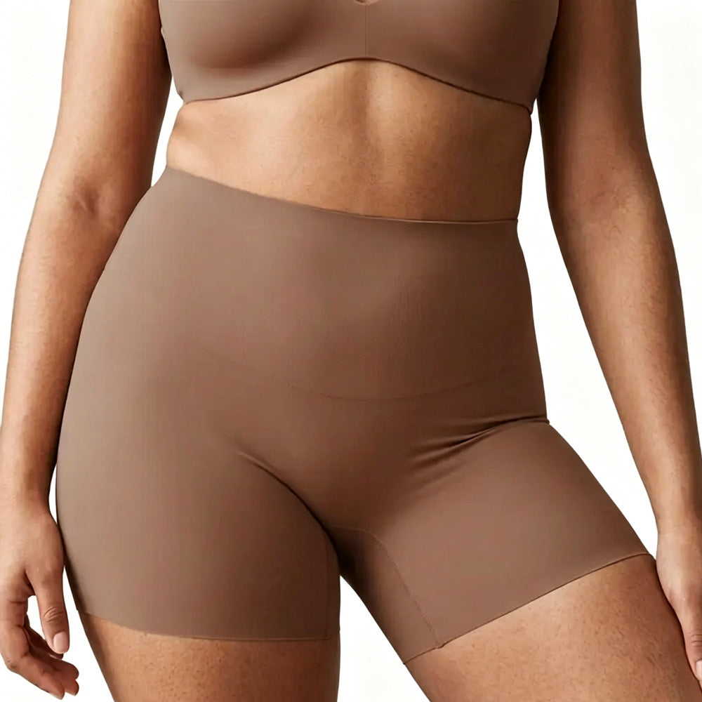 Brown shapewear top and shorts on a plain background