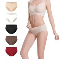 Woman wearing a beige bra and panties with color swatches on a white background