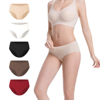Woman wearing a beige bra and panties with color swatches on a white background