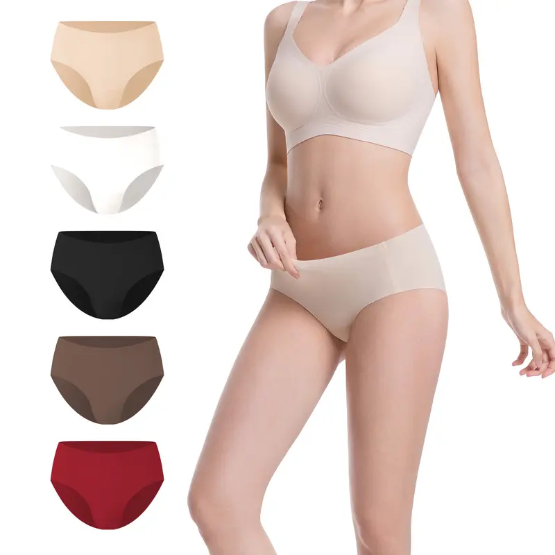 Woman wearing a beige bra and panties with color swatches on a white background