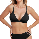 Woman wearing a black bikini on a white background