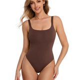 Woman wearing a brown swimsuit on a white background