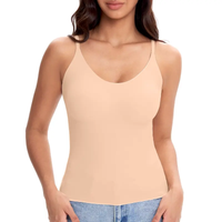 Woman wearing a beige tank top on a white background