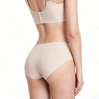 Beige shapewear top and shorts on a white background