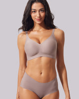 VRCÔMFY gray seamless non wired bra in a soft, smooth fabric modeled for daily comfort | Supportive wirefree bras for women with a minimalist design