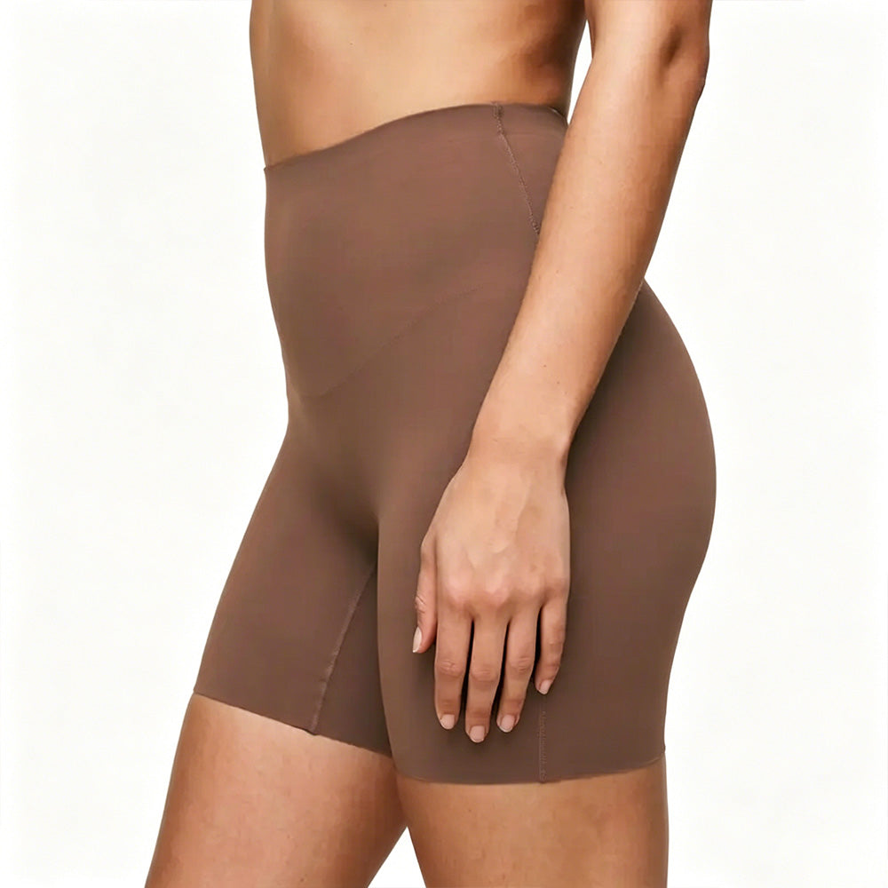 Brown shapewear shorts worn by a person on a white background