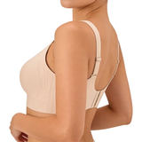 Beige bra worn by a model on a white background
