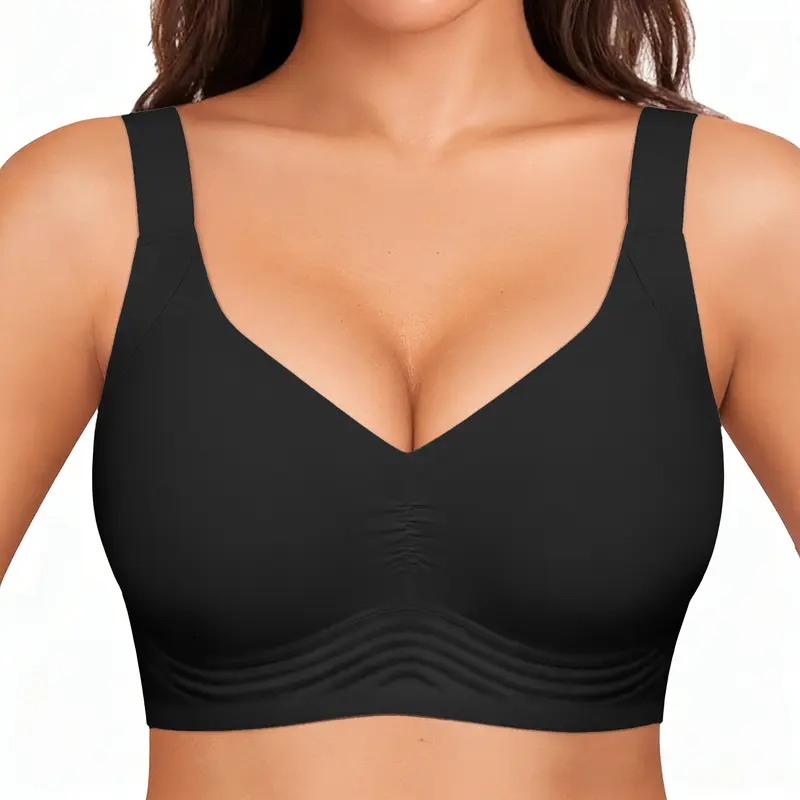 Black bra worn by a model on a white background