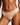 Close-up of a model wearing a beige bikini bottom against a light gray background.