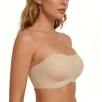 Beige strapless bra worn by a model on a white background