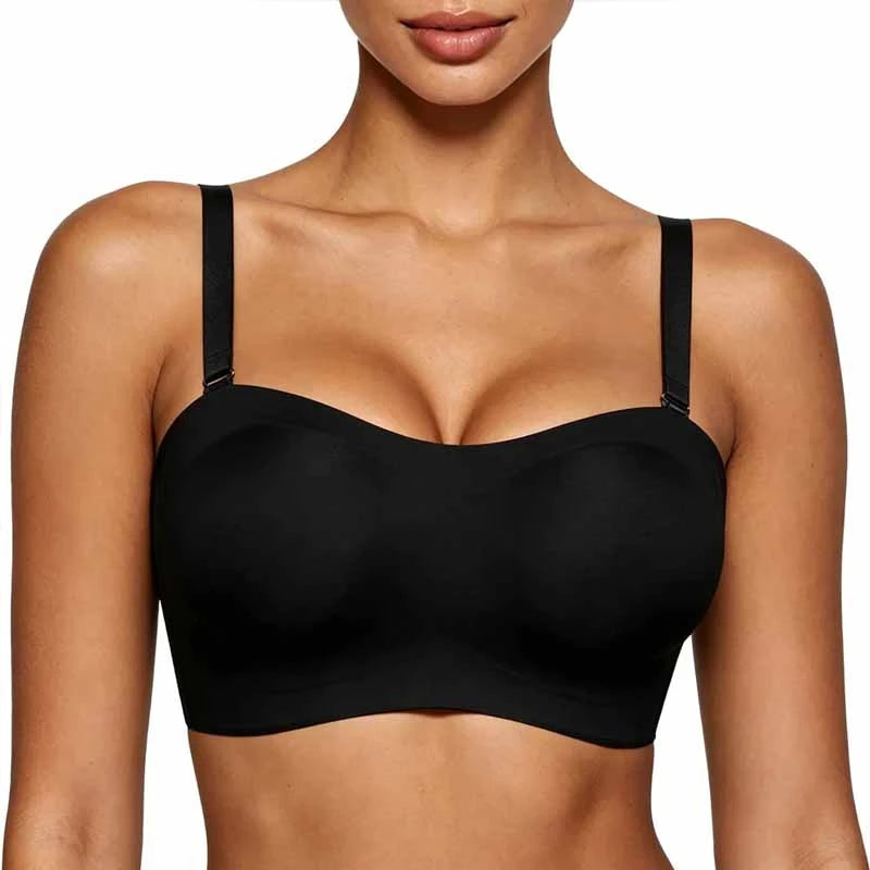 A close-up of a woman wearing a black wireless bra with adjustable shoulder straps against a plain white background.
