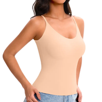 Woman wearing a beige tank top on a white background