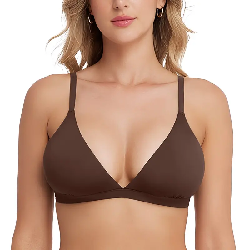 Woman wearing a brown bra on a white background