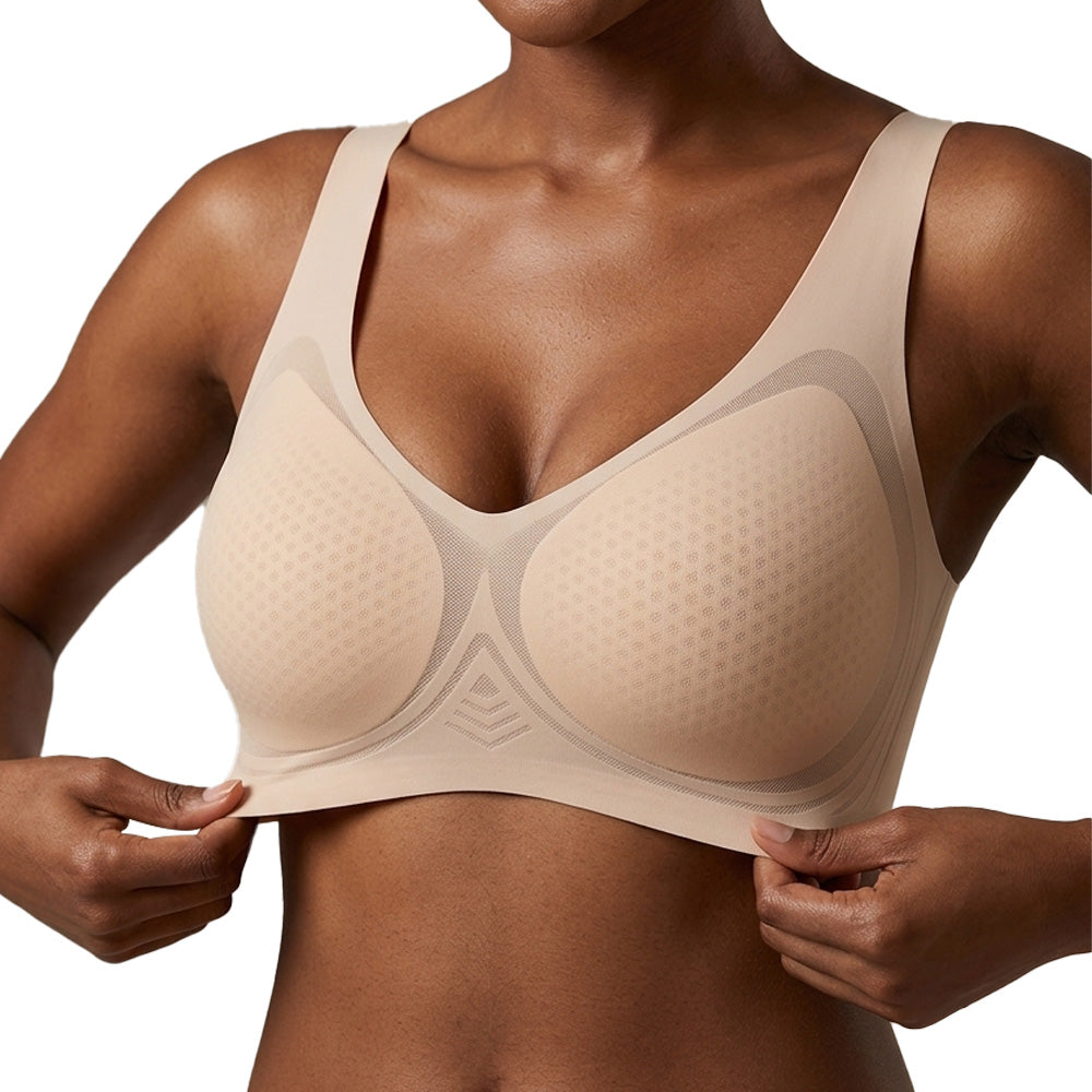Beige bra worn by a person on a white background