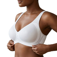 White bra worn by a person on a white background