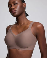 VRCÔMFY gray uplift wireless bra with sheer mesh accents and adjustable straps | Engineered with targeted support panels for enhanced cleavage and sculpted shape