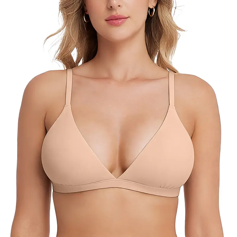 Beige bra worn by a model on a white background