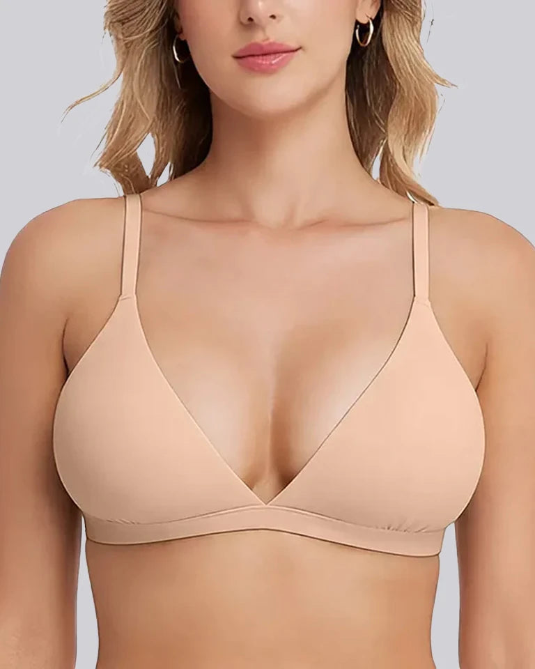 Beige bra worn by a model on a white background