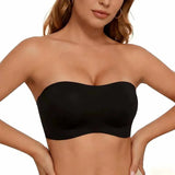 Black strapless top worn by a model on a plain background